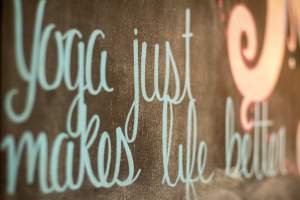 "Yoga just makes life better" chalkboard