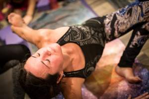 female yoga student on cosmic mat