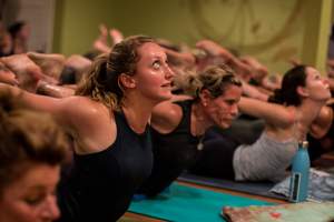 students sweating during hot yoga class